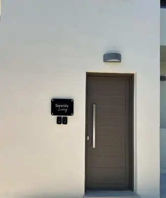 a door with a sign that reads sympathy next to it at Serenity Living in Palaiochóra