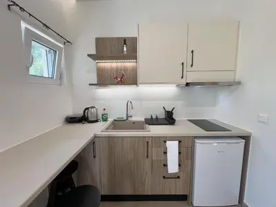 a kitchen with a sink and a counter top at AZOGIRE Resort in Azoyirés