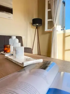 a book sitting on top of a wooden table at Olives Villa in Anopoli Sfakion