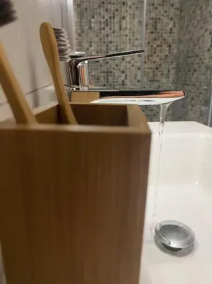 a stream of water coming out of a kitchen faucet at Olives Villa in Anopoli Sfakion