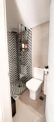 a bathroom with a white toilet in a room at Gkerola house - small cozy house close to Chania town center in Chania Town