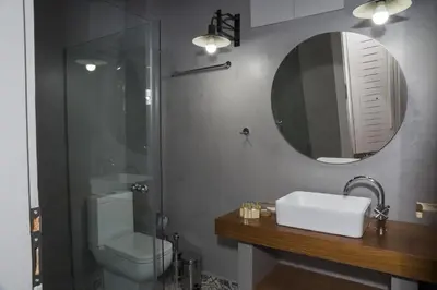 a bathroom with a toilet and a sink and a mirror at Elia Daliani in Chania Town