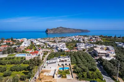an aerial view of a small town on the ocean at Sun Flower Villas in Agia Marina Nea Kydonias