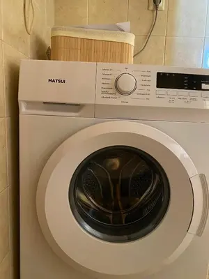 a white washing machine in a room with at Evgoro in Chania Town