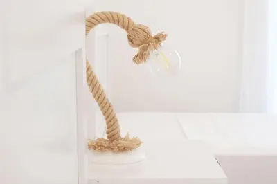a rope hanging on a shelf with a hook at Delvia Luxury Residence in Agios Onoufrios