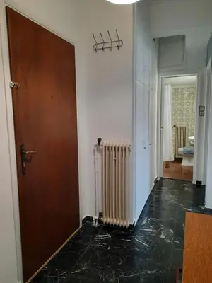 a hallway with a door and a black floor at Apartment Chania - Nea Chora in Chania Town