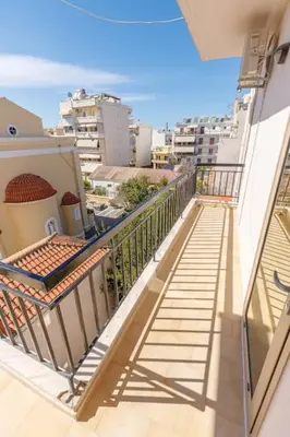 an apartment balcony with a view of a city at TziApartment in downtown Chania in Chania Town