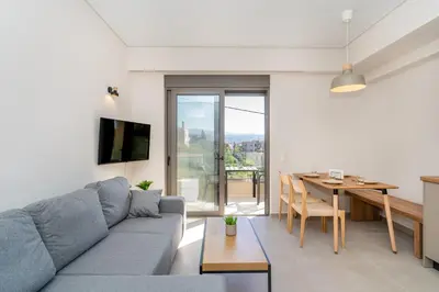 a living room with a couch and a table at Dreta Suites in Chania Town