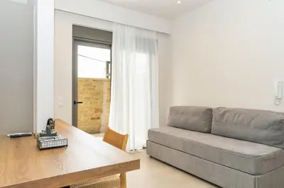 a living room with a couch and a table at Dreta Suites in Chania Town