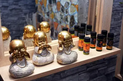 a group of skulls on a shelf with bottles of oils at Relaxed Dream home in Chania Town