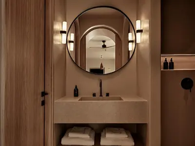 a bathroom with a sink and a mirror at Tella Thera, a Member of Design Hotels in Kissamos