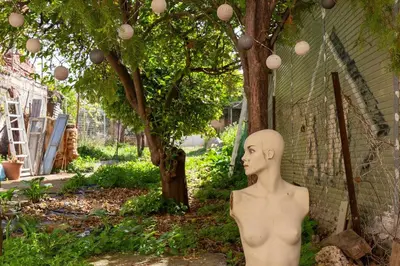 a statue of a mannequin in front of a building at Backyard Art Studio in Chania Town