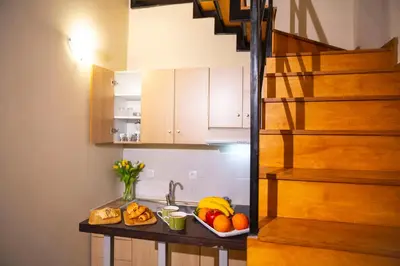 a kitchen with a sink and some fruit on a counter at Casa Stella in Chania Town