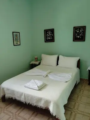 a bedroom with a bed with two towels on it at Levendi's House in Kissamos