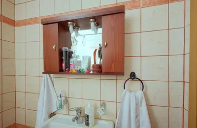 a bathroom with a sink and a mirror at Levendi's House in Kissamos