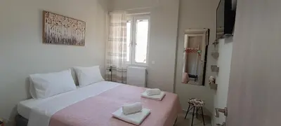 a bedroom with a bed with two towels on it at Christos in Kissamos