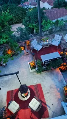 an aerial view of a patio with a table and chairs at Η αυλή της Ασπασίας, Χανιά Κρήτη in Lákkoi