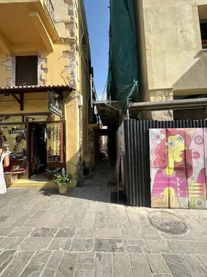 a building with a painting on the side of it at Casa Di Sarpaki in Chania Town