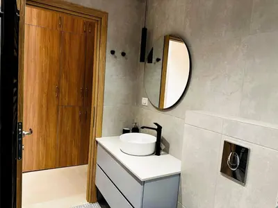 a bathroom with a sink and a mirror at Roussos Place - Next To Splantzia Square - 2bd 2ba in Chania Town
