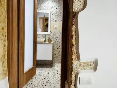 a bathroom with a sink and a mirror at Roussos Place - Next To Splantzia Square - 2bd 2ba in Chania Town
