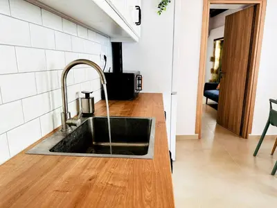 a kitchen with a sink and a counter top at Roussos Place - Next To Splantzia Square - 2bd 2ba in Chania Town