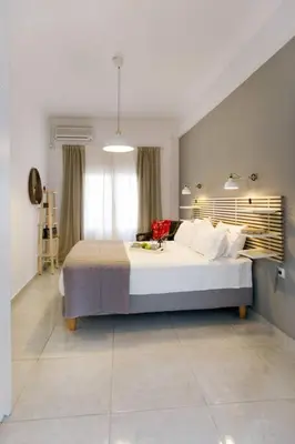 a bedroom with a large bed in a room at Modern House in the Old Town in Chania Town