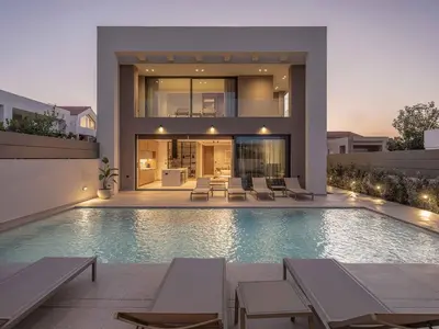 a house with a swimming pool in front of it at Sancy Luxury Villa I 400m beach, 