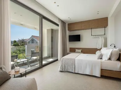 a bedroom with a large bed and a large window at Sancy Luxury Villa I 400m beach, 