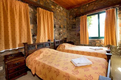 a bedroom with two beds and a window at Amazing sea views at villa Elafonissi with private pool, near Elafonissi beach in Chania Town