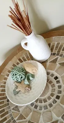 a white vase sitting on top of a table at Casa Lazareta in Chania Town