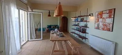 a living room with a wooden table in a room at Casa Lazareta in Chania Town