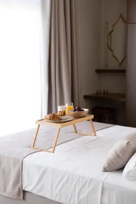 a tray of food sitting on top of a bed at Once Upon a Home in Chania Town