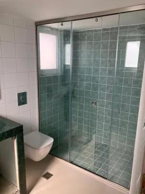 a bathroom with a glass shower with a toilet at Άγιος Ιωάννης in Chania Town