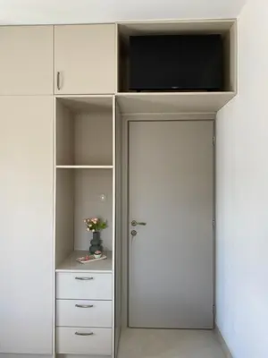 a white closet with a tv on top of it at Άγιος Ιωάννης in Chania Town