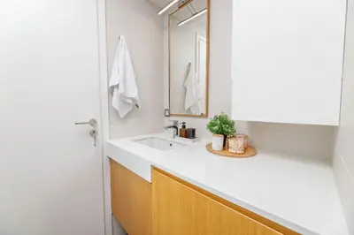 a bathroom with a sink and a mirror at Penny's Apartment in Chania Town