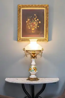 a lamp on a table with a painting on the wall at Modern & Spacious Flat - Chania Center - Walk To Sea in Chania Town
