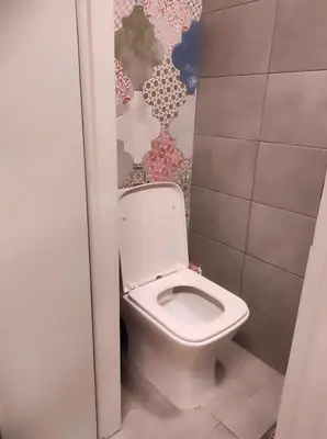 a bathroom with a white toilet in a stall at Ploumi in Chania Town