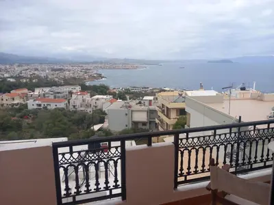 a view of the water from a balcony at Villa Nancy in Chania Town