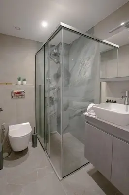 a bathroom with a glass shower and a sink at Luxury Chic Retreat Suites in Chania Town