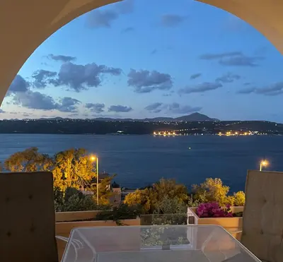 a view of the water from a balcony at Moments in Áptera