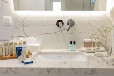 a bathroom counter with a sink and a faucet at Nobel apartment, Chania Town in Chania Town
