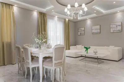 a dining room with a white table and chairs at Nobel apartment, Chania Town in Chania Town