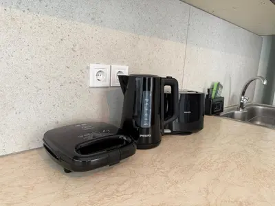 a coffee maker sitting on top of a kitchen counter at Karamela Apartment in Kambánion