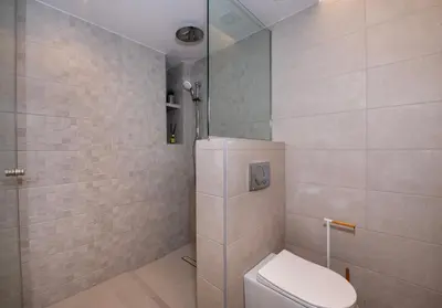 a bathroom with a shower and a toilet in it at Arithea Villa in Chania Town