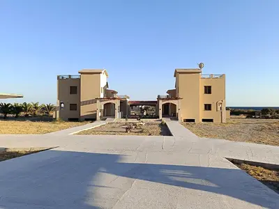 an empty road in front of a building at Paliochora Beachfront Escape, Milolithos Pool Retreats in Palaiochóra