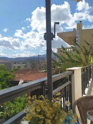 a balcony with a view of the city at Banana Leaves Flat in Chania Town