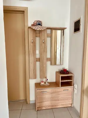 a room with a wooden dresser and a mirror at Yasemi Chania Residences in Chania Town