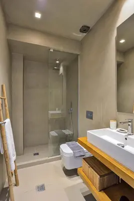 a bathroom with a sink and a toilet and a shower at Alex Downtown Holiday Apartment in Chania Town