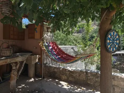 a hammock hanging from a tree in a house at Kourtsa villas in Vafés