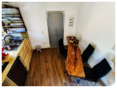 an overhead view of a kitchen with a table and chairs at Kourtsa villas in Vafés